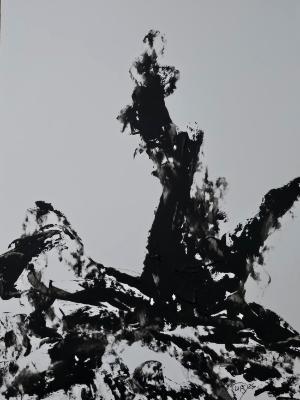 After the color has drained away, a lightning stuck tree stands against a stark background. 